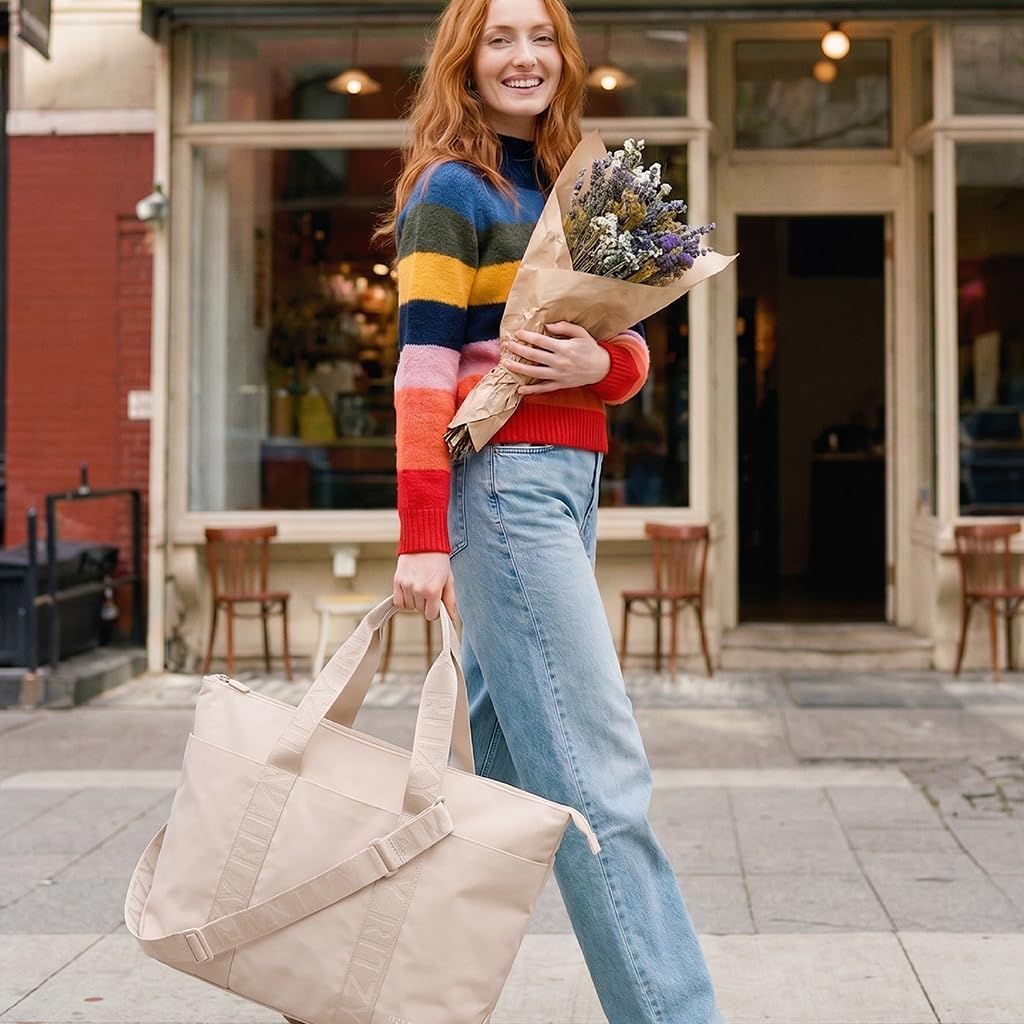 Itzy Ritzy Belong - Bolsa de pañales, bolsa ligera con 10 bolsillos...