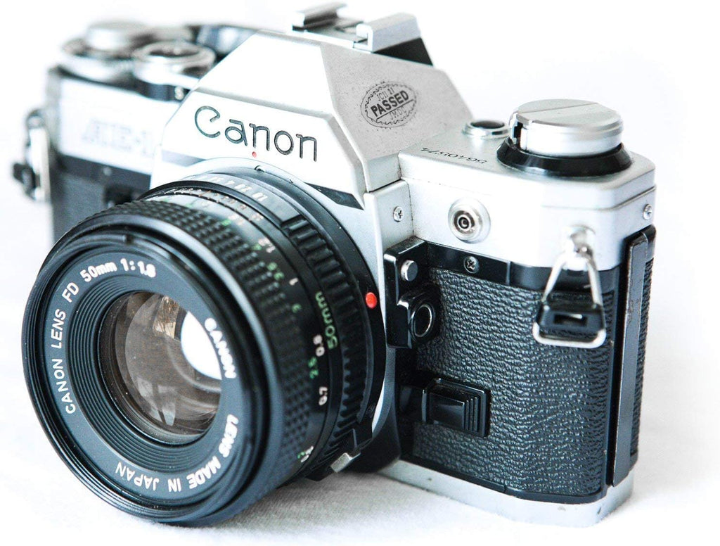 Canon Cámara de película AE-1 de 1.378 in con lente 1:1.8 de 1.969...