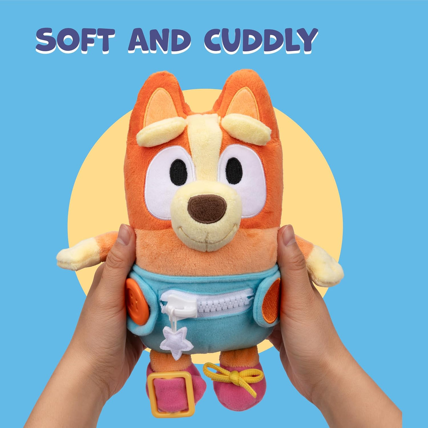 Dress &amp; Play Baby Bingo Bluey de Peluche, Botón, Cremallera, He...
