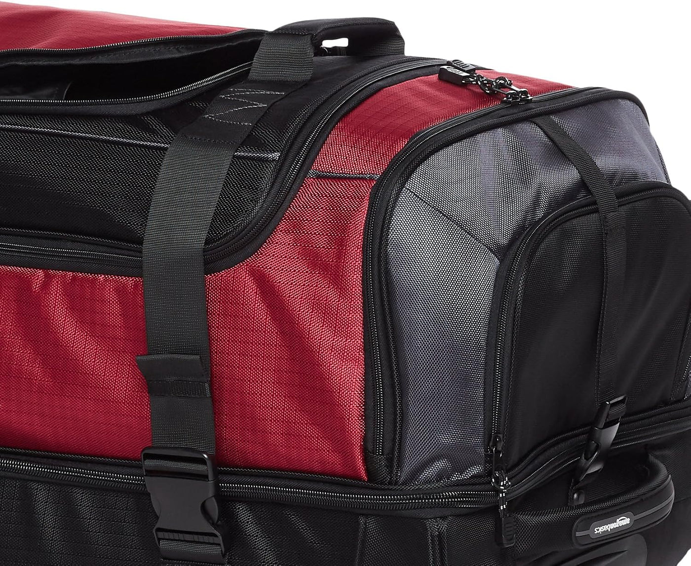 Amazon Basics - Bolsa de viaje con ruedas de Ripstop, Rojo